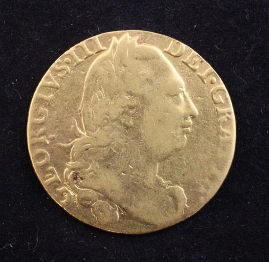 A George III 1776 gold fourth head guinea,